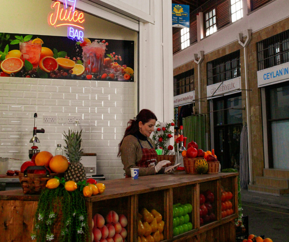 Juice Bar Owner Looking at Phone